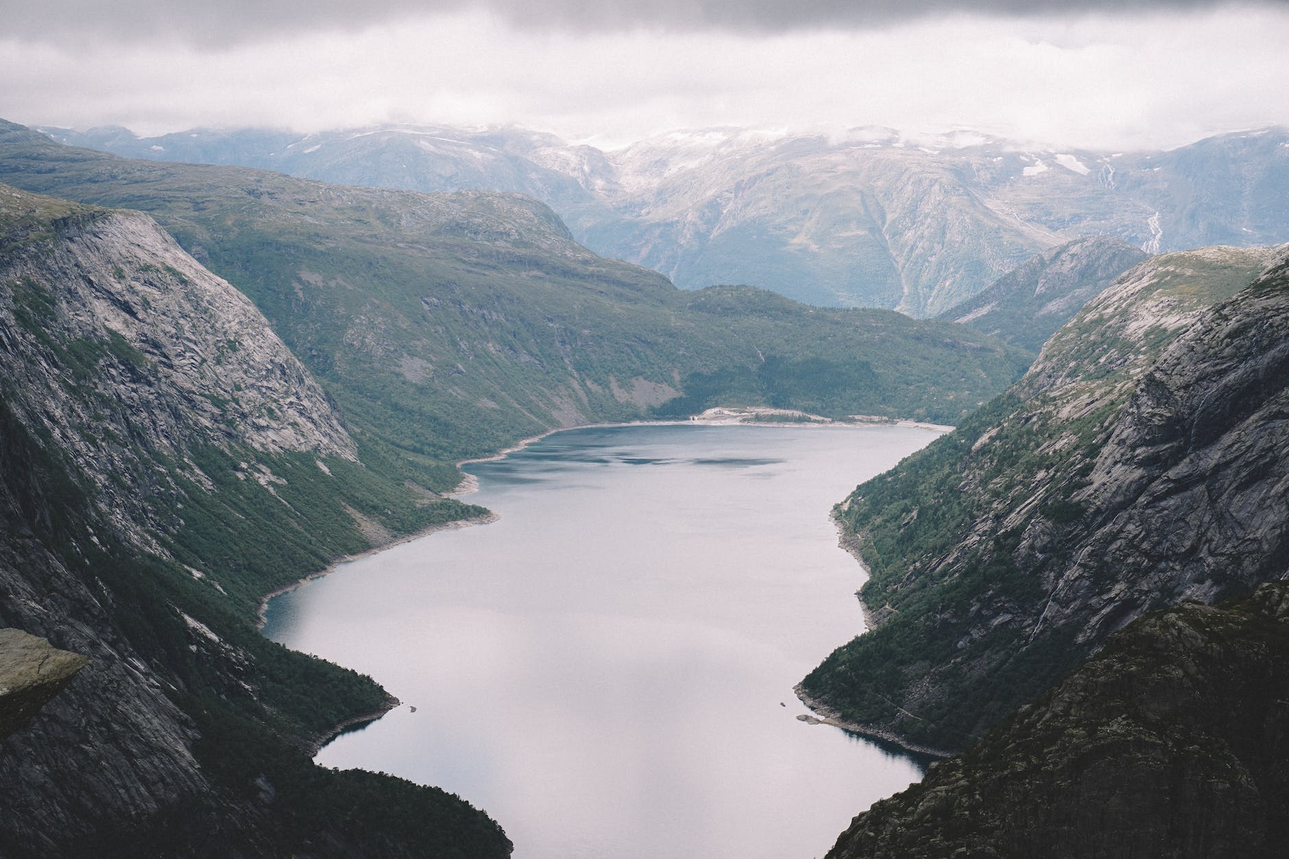 river in the middle of mountains