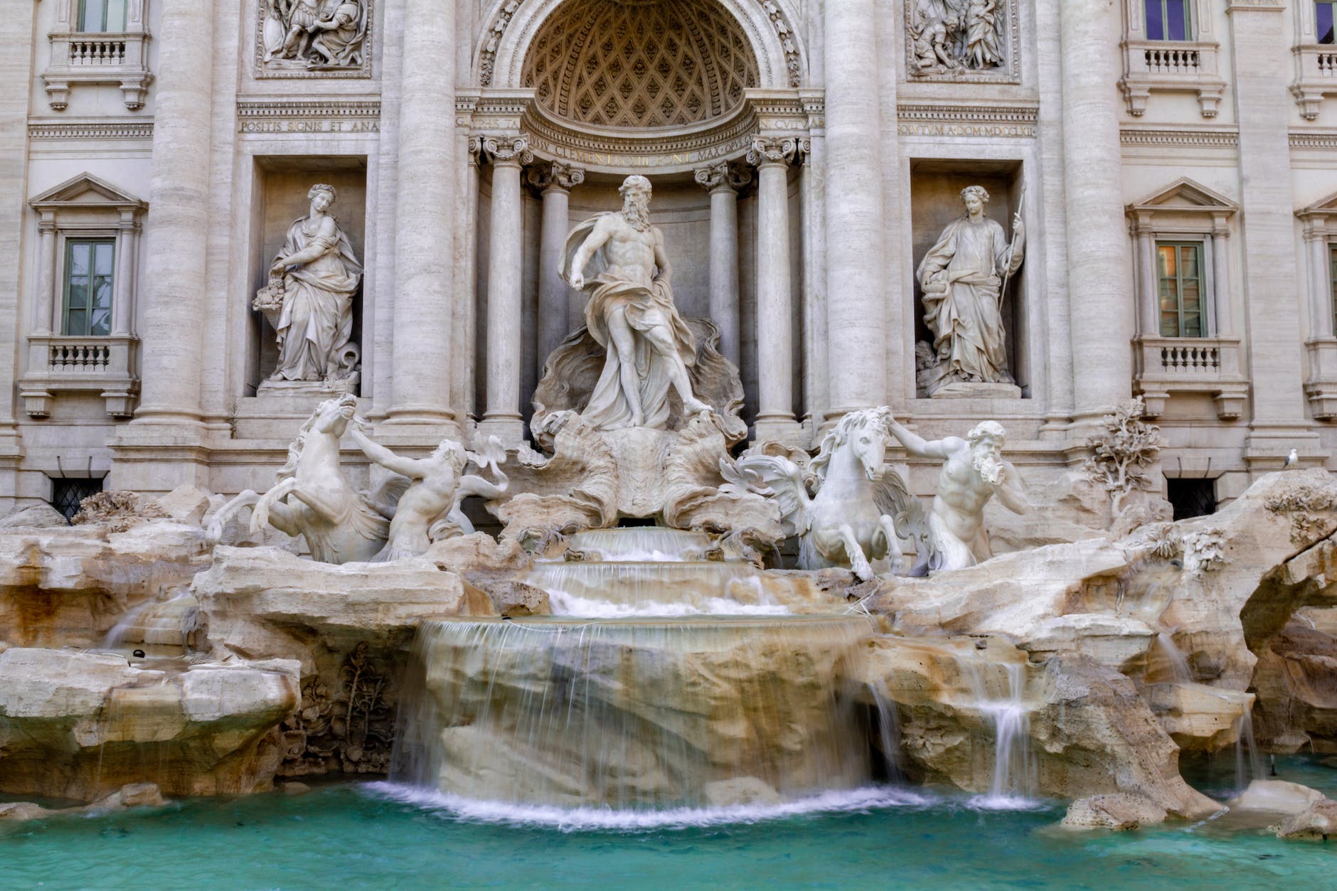 ancient statues in city fountain