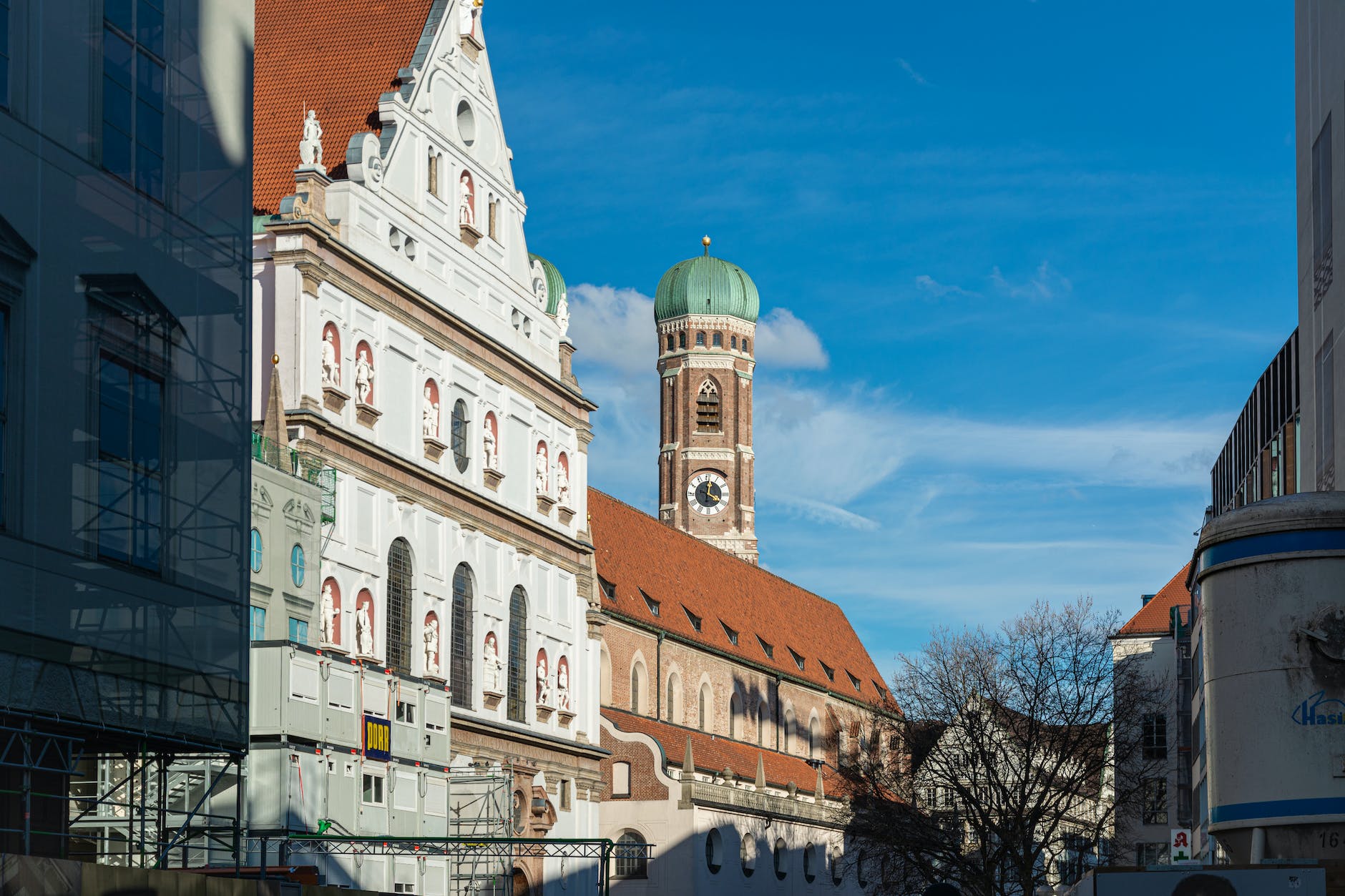 a church with a clock tower on a city street