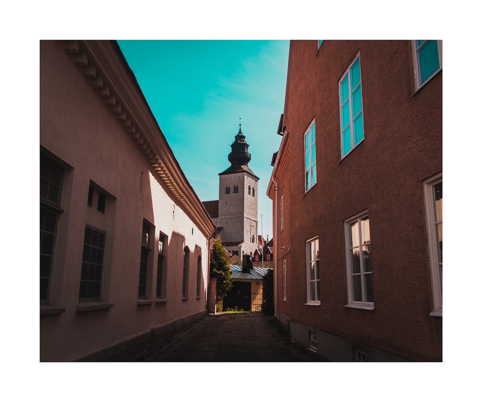 the visby cathedral as seen from an alley