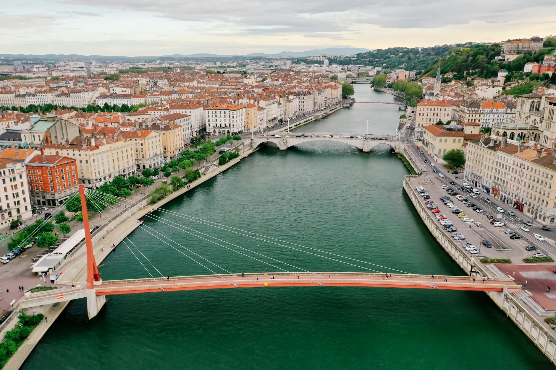 ariel view of palais de justice footbridge above saone river in lyon france